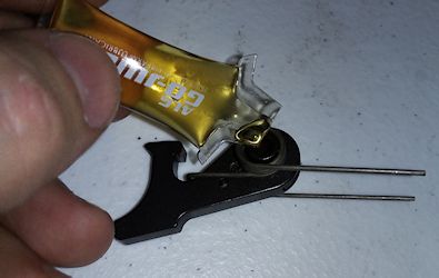 A drop of oil where the hammer pin was removed