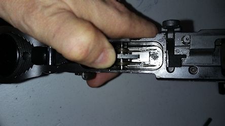 Hold down the disconnector as the pin is removed