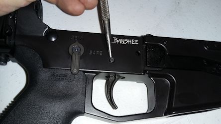 Remove the trigger pin with punch