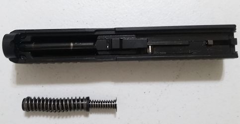 Recoil spring assembly removed