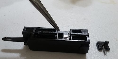 Striker Block hole for the tab